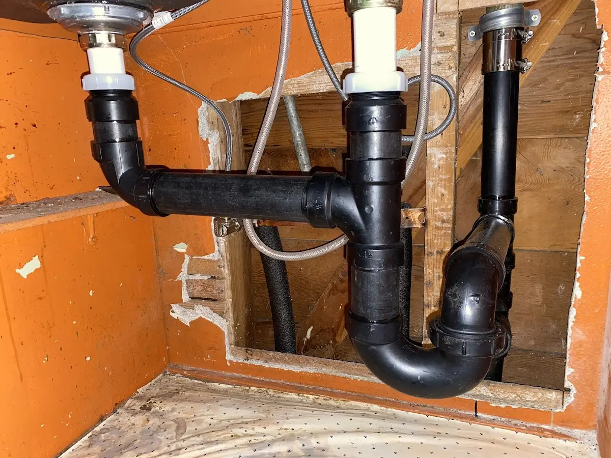 Professional Garbage Disposal Repair equipment and tools on the job in Moultonborough